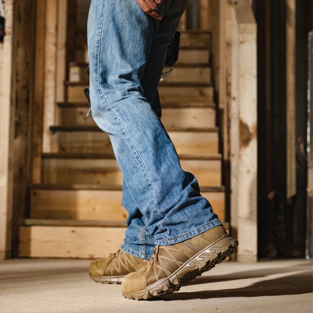 Person wearing Reebok Trailgrip Tactical 6 side zip composite toe boot in coyote