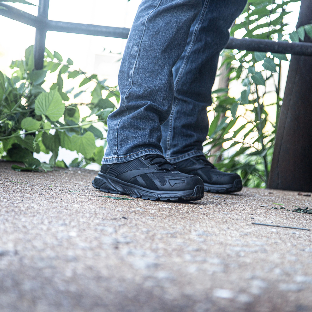 Person wearing Reebok Hyperium Tactical men's 8-inch trail running tactical boot