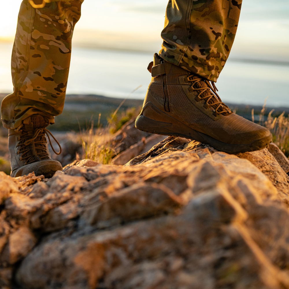 Person wearing Reebok Nano X1 Adventure 6 tactical side zip boot in coyote