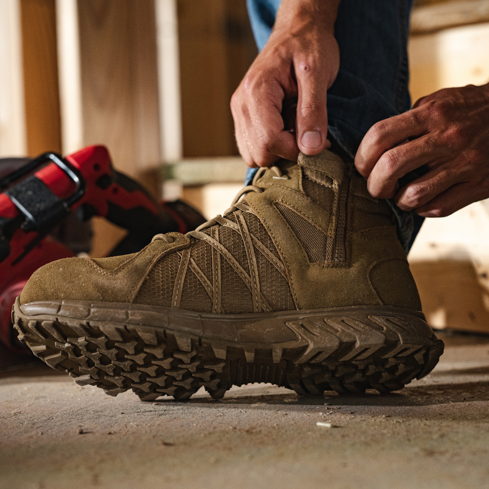 Person wearing Reebok Trailgrip Tactical 6 side zip composite toe boot in coyote