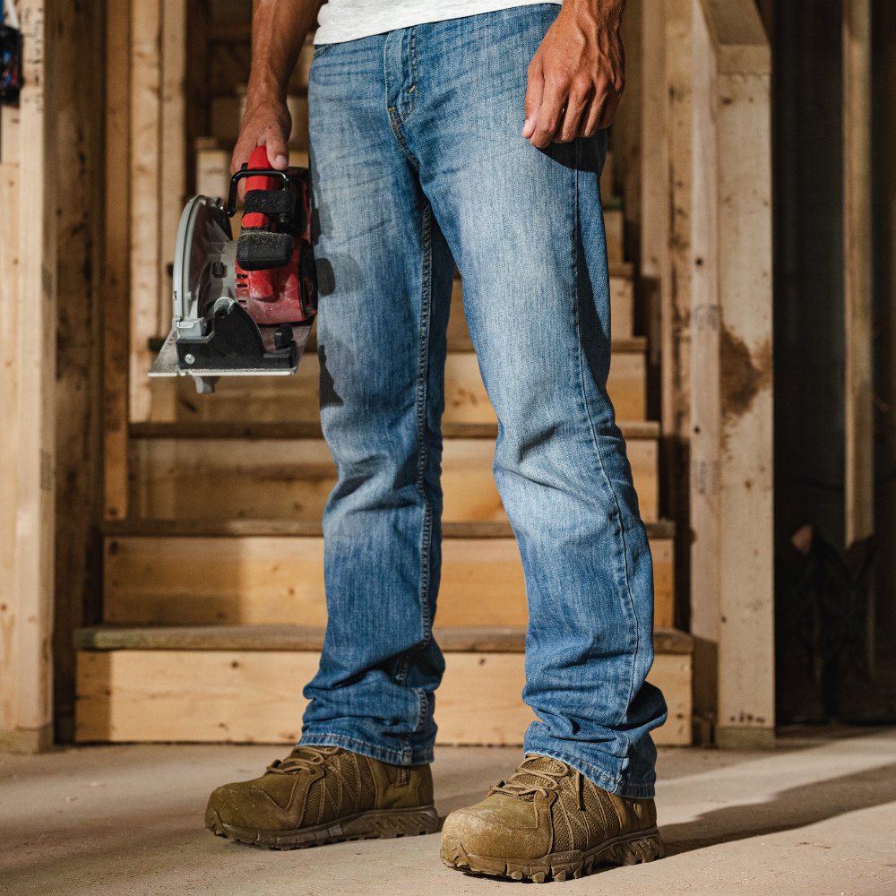 Person wearing Reebok Trailgrip Tactical 6 side zip composite toe boot in coyote