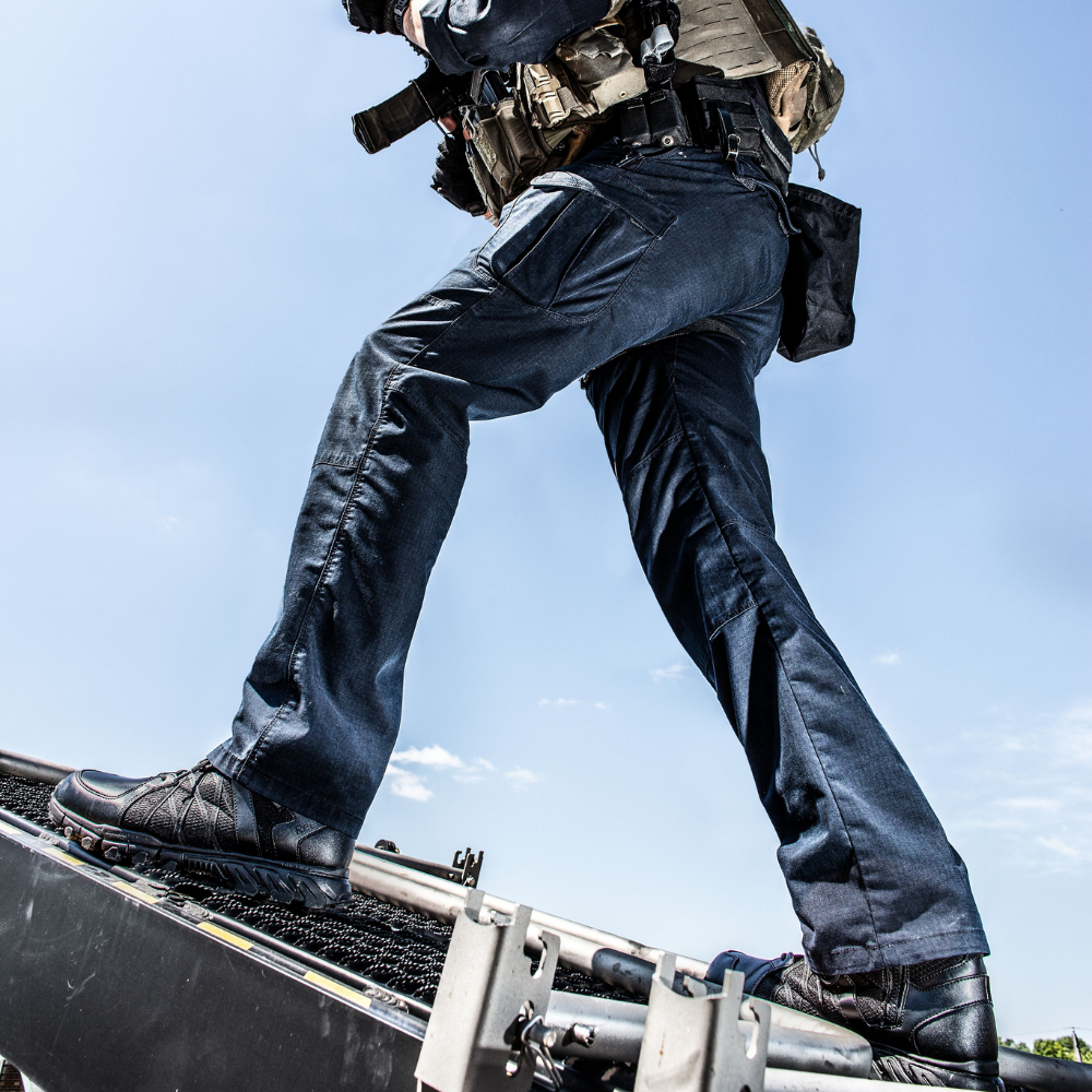 Person wearing Reebok Trailgrip Tactical 8 side zip waterproof boot in black